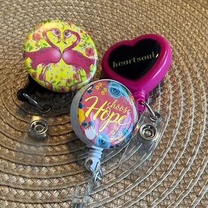 A trio HeartSoul Badge Flamingo Pink and Hopeful floral Reels